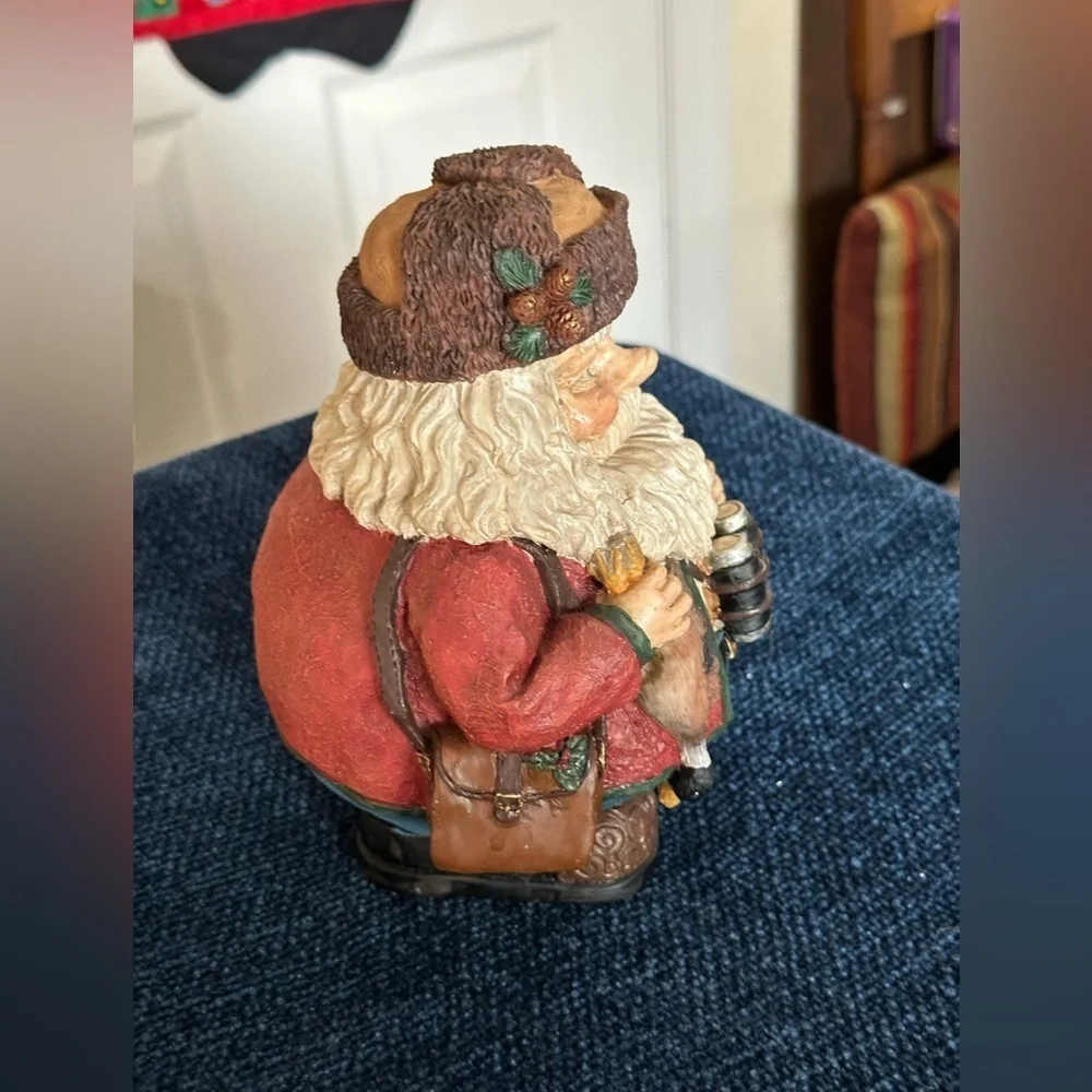 Hunting Santa wears a furry hat!